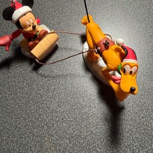 Hallmark ornaments Mickey and Pluto Holiday Sled